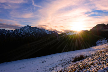 Panoramic sunset with sunrays over Bavarian Alps near Tegernsee