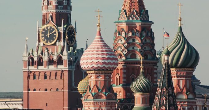 The symbol of Russia and Moscow, the flag of Russia, the Kremlin and St. Basil's Cathedral. Concept of Moscow and Russian history