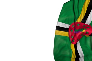 wonderful feast flag 3d illustration. - Dominica flag with big folds lying in left side isolated on white