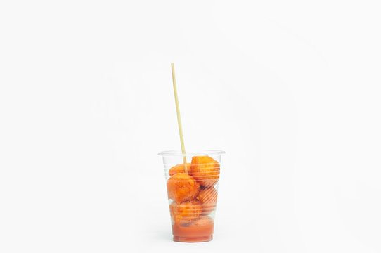 Kwek – Kwek / Tokneneng – A Filipino  Tempura-like Street Food In Plastic Cup. White Isolated Background.