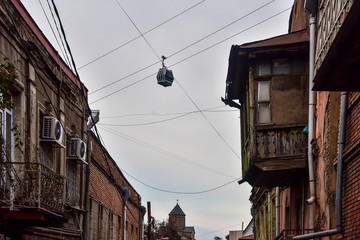 Beautiful cable car view through buildings in Tbilisi, Georgia. Old town Tbilisi. © Serkant