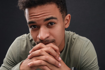 Image of bristle african american guy looking at camera