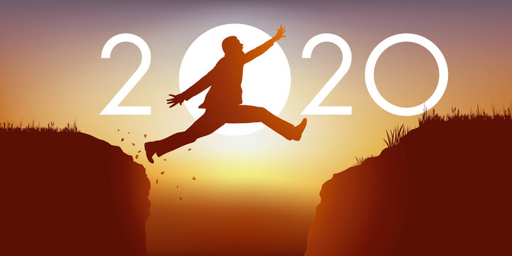 Un homme saute par dessus un gouffre entre deux falaises devant un soleil au zenith et symbolise le passage à la nouvelle année 2020