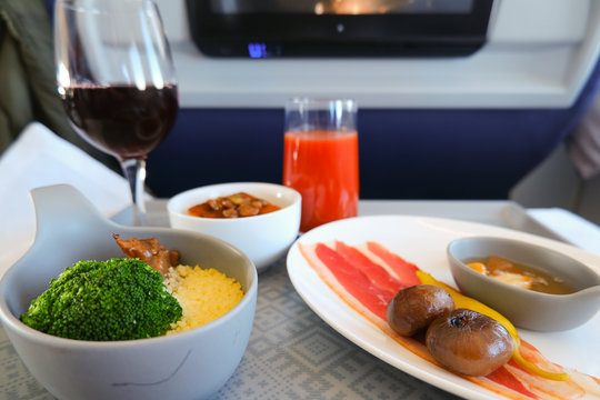 photo of Food served on board of business class airplane on the table