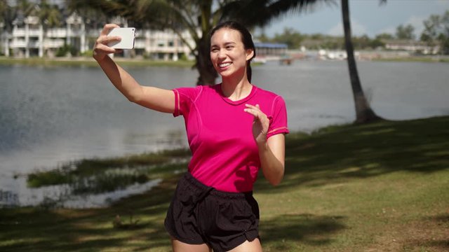 Woman taking selfie during workout