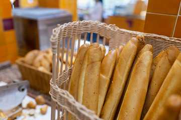 Baguette or french bread are in the wicker basket. People usually eat with butter soup. It is easy...