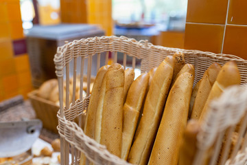 Baguette or french bread are in the wicker basket. People usually eat with butter soup. It is easy...