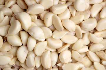 Slices of white garlic for sale at a market