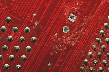 Spoiled motherboard close up. circuit board with dust and defects. micro elements of computer. Intelligent technology abstract background