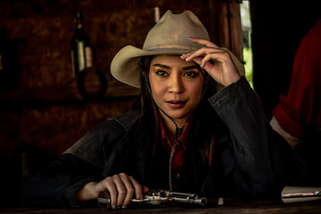 cowgirl with a gun.life style of cowgirl.beautiful girl cowboy with a gun.