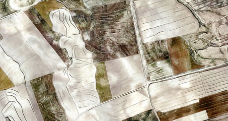 the model,Abstract photography of Spanish fields from the air, Cubist composition of human labor...