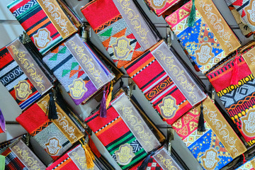 Traditional Arab wallets with Fatima's hand ornament in the gift shop