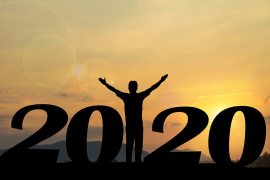 Happy new year Silhouette sunset background. A man standing instead  number 1 word. A man standing between 20 and 9.new year,success ,2019, Photo Silhouette and new year  concept idea.