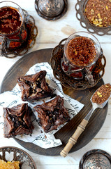 Eastern sweets and traditional tea on a white background