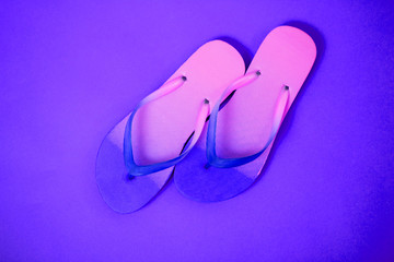 Beach flip flop on yellow background