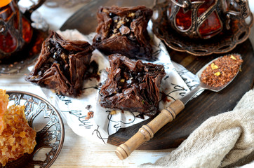 Eastern sweets and traditional tea on a white background