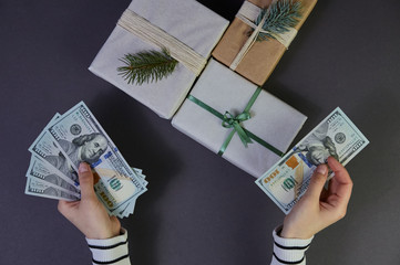 On a gray back are wonderful gifts for the New Year holidays, which give joy and happiness to their...