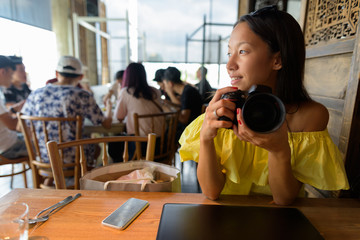 Young beautiful tourist woman exploring the city of Bangkok