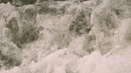 High Angle View Of Rippling Splashing Ocean Waves. Rippled sea water wave Wallpaper wet background decor for mobile and desktop screens. Vintage retro style colour effect. Copy space room for text.