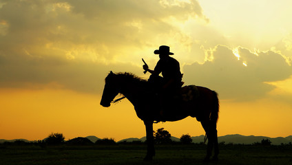 Fototapeta na wymiar cowboy and horse at first light,mountain, river and lifestyle with natural light background 
