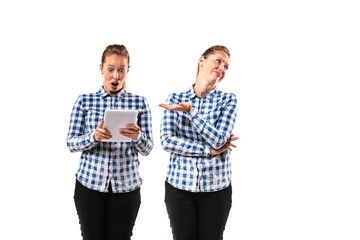 Young handsome woman arguing with herself on white studio background. Concept of human emotions,...