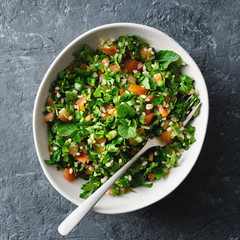 Healthy summer tabule salad bowl top view copy space