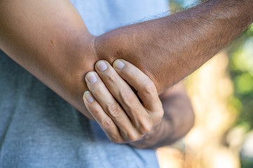 Fototapeta premium Close-up man with Arm ache ,Health and pain concept