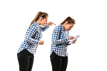 Young handsome woman arguing with herself on white studio background. Concept of human emotions,...
