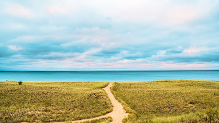 Single sandy path leading to lake michigan from the dunes - Powered by Adobe