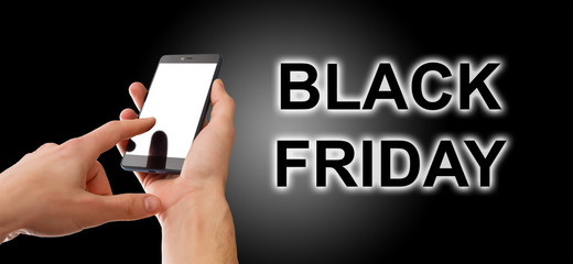 Hand holding cellphone with black friday text and shopping cart
