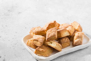 Cottage cheese cookies on a rectangular ceramic plate on a light gray background	