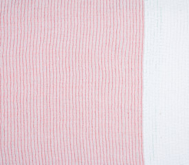 reverse side with a stitching of a red thread of fabric with embroidery with multi-colored sequins