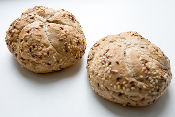 Fresh crispy buns on a light background