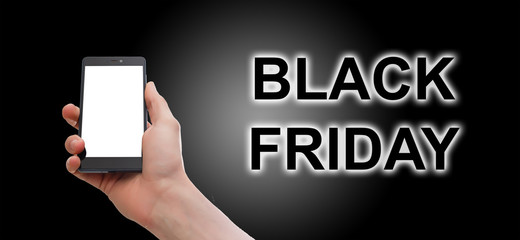 Hand holding cellphone with black friday text and shopping cart