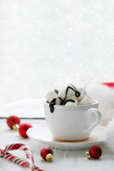 Obraz na płótnie Canvas Winter cozy hot chocolate in front of window, snow, sweater. Lazy weekend, love, comfort