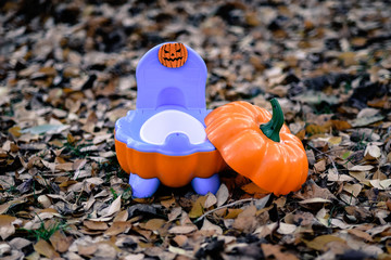 Children's pot in the shape of a pumpkin or Halloween style potty training