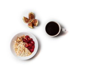 Breakfast oatmeal porridge with fruits berries and coffee cup. Healthy breakfast concept.