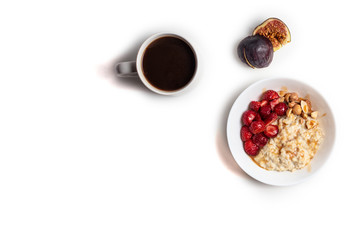 Breakfast oatmeal porridge with fruits berries and coffee cup. Healthy breakfast concept.