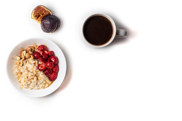 Breakfast oatmeal porridge with fruits berries and coffee cup. Healthy breakfast concept.