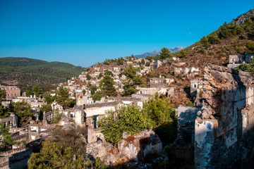 Fototapeta premium Ruins of Kayakoy Village in Fethiye Town, Kayakoy Village is old abandoned historical Greek village