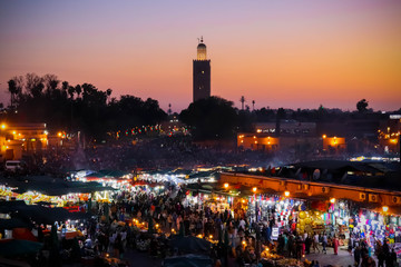 Fototapeta na wymiar The famous Jemaa el-Fna square of Marrakesh medina during the sunset in morocco