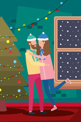 happy merry christmas couple celebrating with pine tree