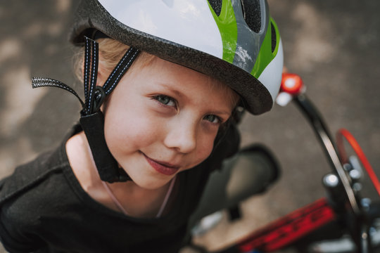 Cute little girl in safety bicycle helmet