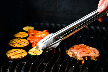 chef cooks grilled steak