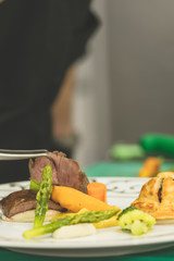 Chef is making final touch to the plate