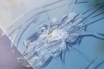 Smashed windscreen of a car, damaged glass