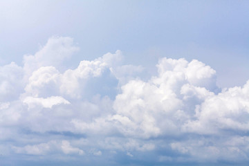 blue sky background with tiny clouds.