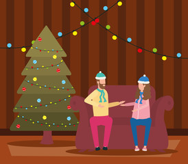 christmas couple celebrating in livingroom with pine tree