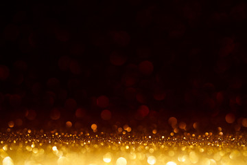 Fototapeta na wymiar Christmas Background. Golden Glitter On Shiny Red