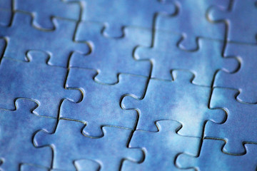 Blank puzzle with blue tint, macro